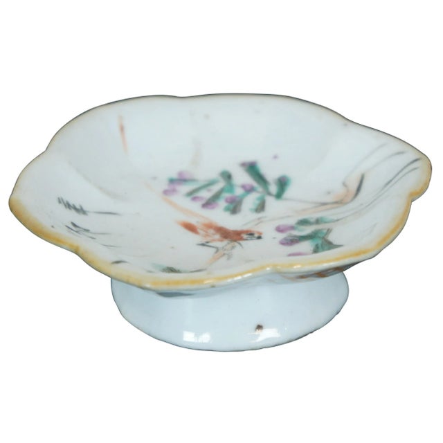 Antique late 19th – early 20th century Chinese export footed porcelain dish with a lotus flower shape, painted with a bird...