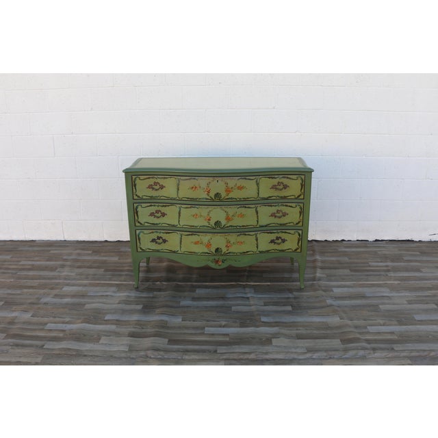 Beautiful vintage French Provincial style dresser, circa 1950s, crafted from solid wood and featuring a distinctive hand-...