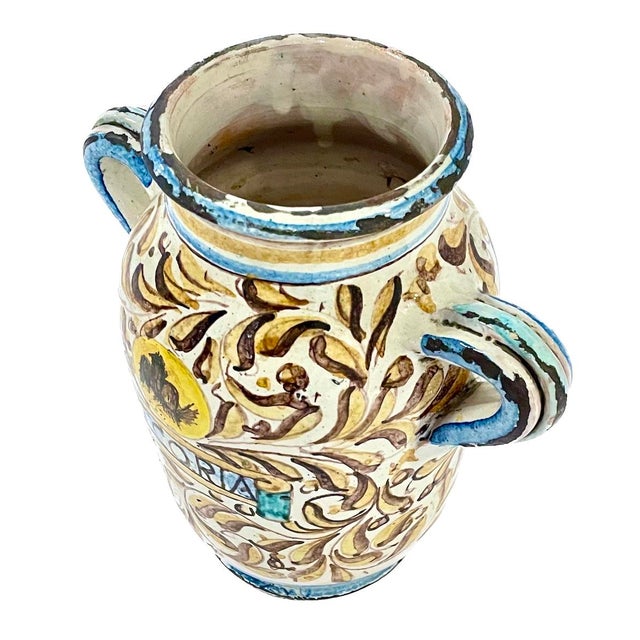 Vintage Italian hand painted chicory/ cicoria urn jar with two handles. Decorated with foliation and a bird in a medallion...