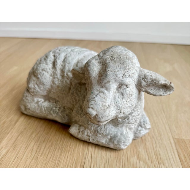 This soulful vintage recumbent lamb sculpture is masterfully crafted from cast stone, featuring an expressive, tactile...