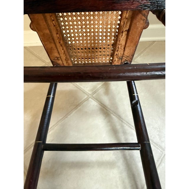 Original Hitchcock/Federal period ebonized and painted high chair, likely from New England circa 1820. Cane seat appears...