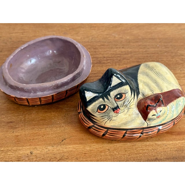 Handmade papier-mâché box, handpainted and shaped to the form of two cats in a basket. Light age wear to lacquer. Rare and...