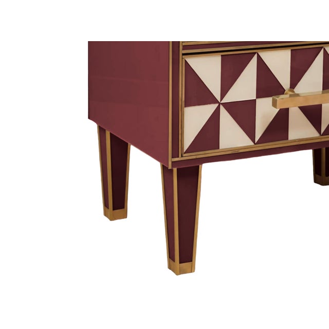 This pair of red and white Murano glass “optical” nightstands with brass trim is a stunning representation of mid-century...