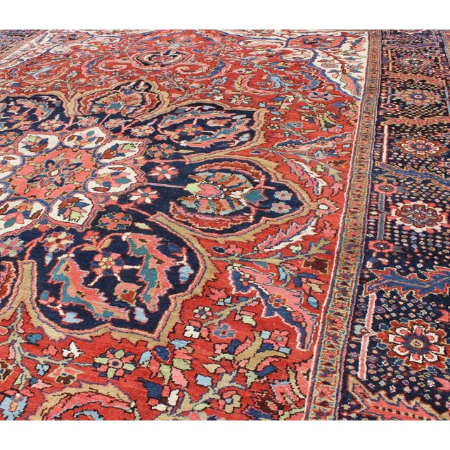 1930s Large Persian Heriz Rug With Geometric Medallion in Rust, Yellow, Green and Blue For Sale - Image 5 of 12