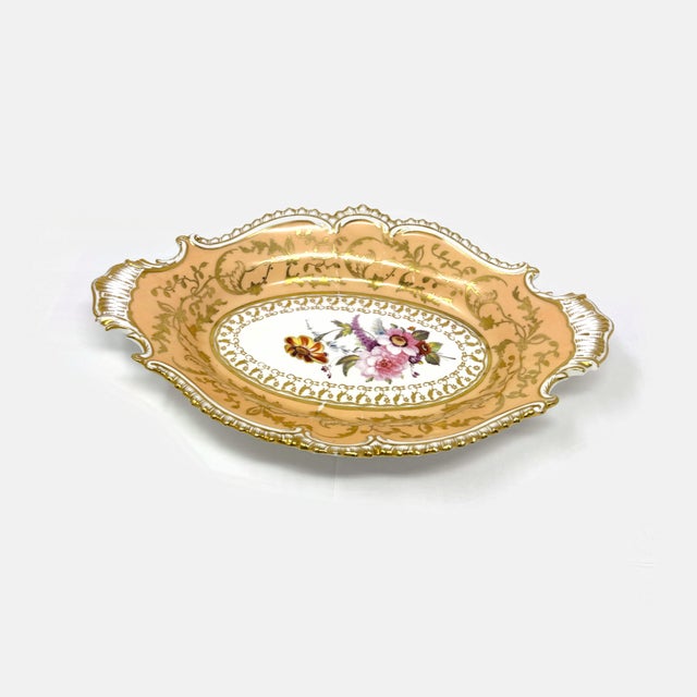 Add timeless elegance to your collection or home decor with this exquisite antique oval porcelain serving dish. Featuring...