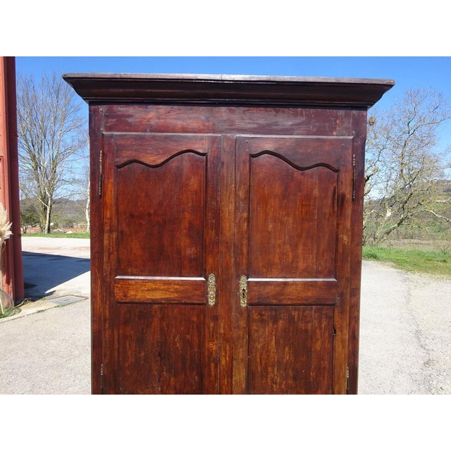 Beautiful, medium-sized Louis Philippe period wardrobe in solid walnut. Two large, paneled walnut doors with original...