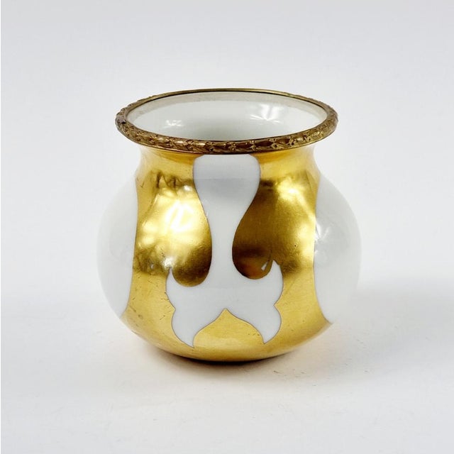 Beautiful Sevres porcelain vase (France, early 20th Century). Gilt bronze rim. The vase is extremely decorative and thanks...