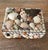 A sweet, vintage, collection of seashells showcased on a felted box exemplifying a bit of folk art from the ‘70s.