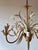 Italian eight-light chandelier manufactured by masca, dating to the 1970s. Constructed in gilt metal with white painted...