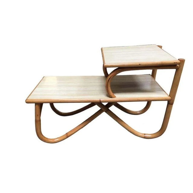 Arch leg rattan side table with two-tier Formica tops. 1950, United States Measurements of overall height is 22", distance...