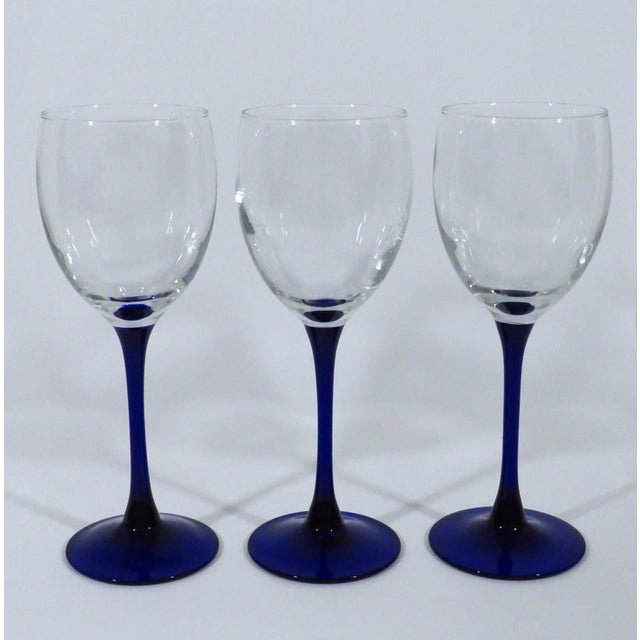 Vintage French Luminarc white wine glasses with cobalt blue stems. Dated to 1970s/1980s. Good condition, minor...