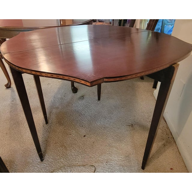 This mahogany flip-top Hepplewhite gaming table was made c. 1900 by the Valiant Furniture Co. of Baltimore, known for its...