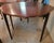 This mahogany flip-top Hepplewhite gaming table was made c. 1900 by the Valiant Furniture Co. of Baltimore, known for its...