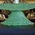 Elegant Bohemian glass epergne featuring a three-tiered tidbit tray design in rich green overshot glass. The textured...