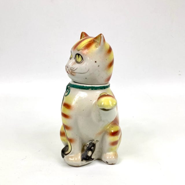A delightful vintage cat tea pot from 1920s China. Porcelain and Hand painted. Has somewhat of a Louis Wain aesthetic!