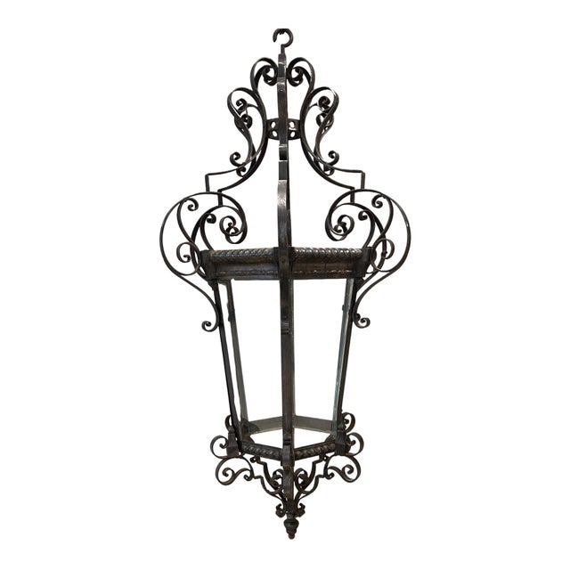 This striking 19th-century Italian lantern features beautifully executed scrolled ironwork, with sinuous curves and...