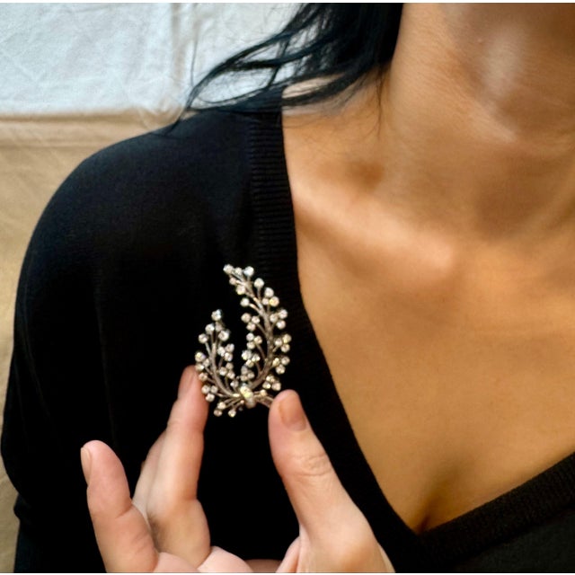 This alluring vintage lapel brooch of opulent aesthetic and unmatched sophistication depicts a most precious bunch of...