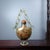 This distinctive snuff bottle is crafted from clear glass and features an intricate hand-painted interior scene. The...