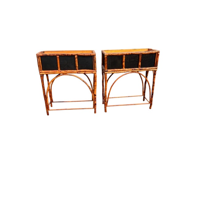 Pair of Vintage Faux Bamboo & Tole Planter Stands A charming pair of vintage planter stands featuring faux bamboo frames...