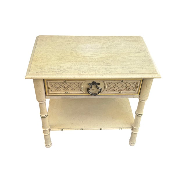 Faux bamboo style end table / night stand. Has Faux bamboo metal drawer pull, and wonderful fretwork design on front of...