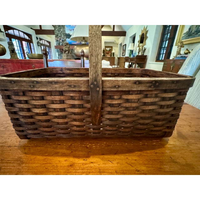 An exceptional basket in excellent vintage condition from Chesterfield, MA. Hefty, handmade with pounded ash, brass and...