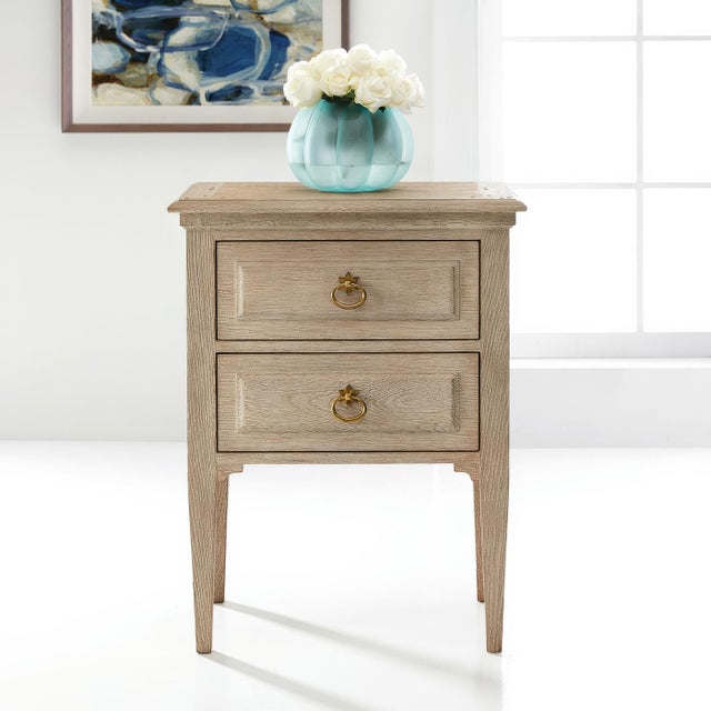 Masterfully crafted in weathered oak to reflect authentic 18th-century design. The two drawers feature refined panel...