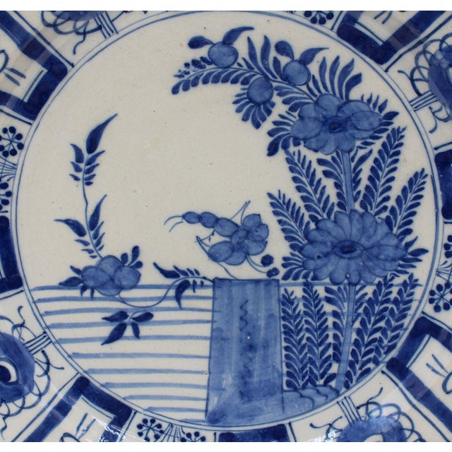 Mid-late 18th century Delft blue & white floral charger in the Chinese taste, Dutch. Paneled border, after 17th century...