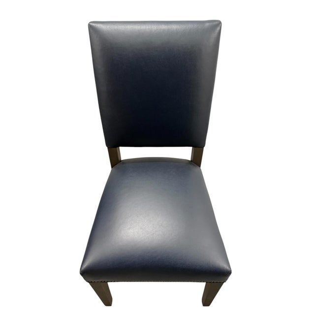 Quick Hits: - Arhaus Torino Leather Side Chair - Streamlined and sophisticated design - Pairs seamlessly with Torino Lucia...