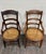 This is a matched pair of antique Victorian armchairs, dating to approximately 1890–1910. Each features a curved ladder...