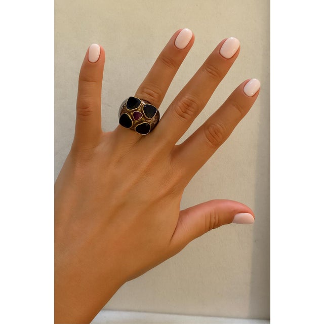 This distinctive ring is crafted in silver with 18 karat yellow gold settings and features a bold, sculptural design...