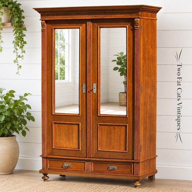 Elevate your home with this magnificent antique double-door armoire wardrobe. Crafted with a rich, warm-toned exterior...