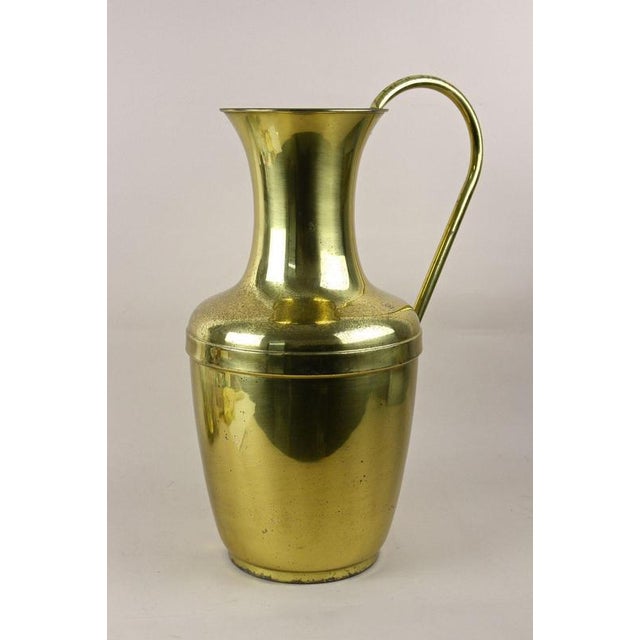 Fantastic, large mid century amphora brass vase with handle from the 1940/50s in Austria. This decorative, brass vase has...