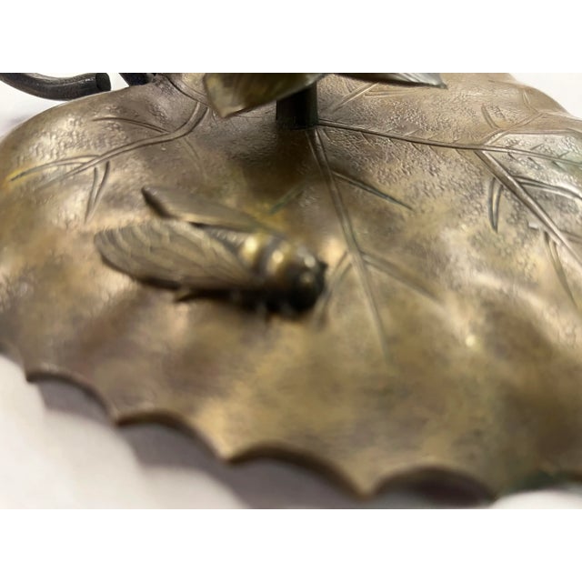 Antique early 20th century Arts & Crafts brass candle holder in the form of a lily pad with a bee resting on the leaf and...