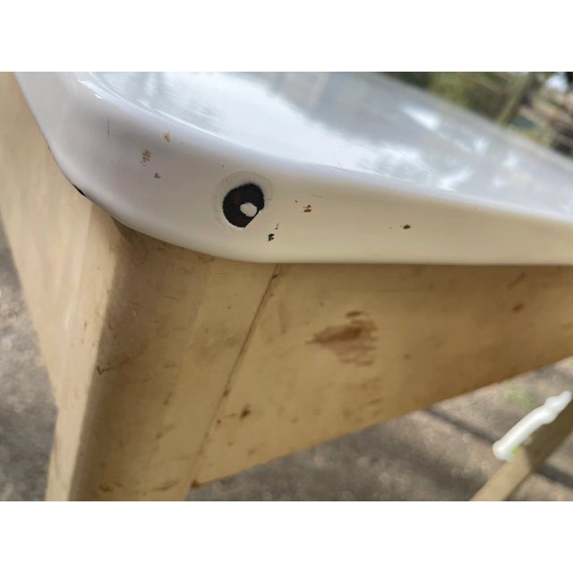 Vintage white enamel table in its original condition. The enamel top is in excellent condition. The metal red drawer pull...