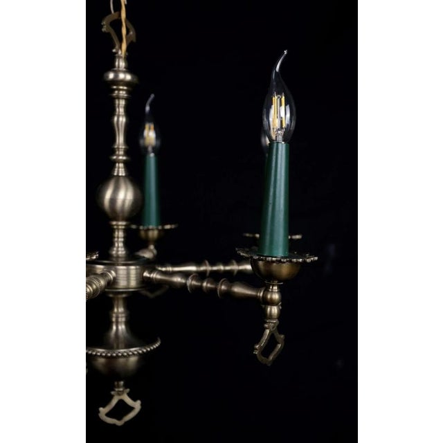 High-quality chandelier made of patinated brass in the renaissance style. The chandelier has been restored: new old-style...