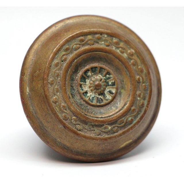 This concentric style brass doorknob was made by Russell & Erwin in the 1909 catalog. It is part of the M-16400 Ossa...