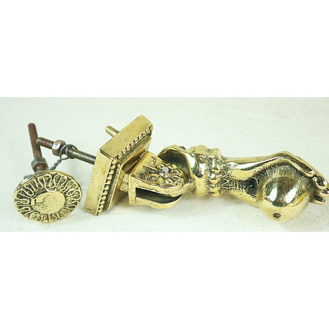 An ornate mid 19th century French door brass knocker of the Napoleon III period. It is in the form of a woman's hand and...