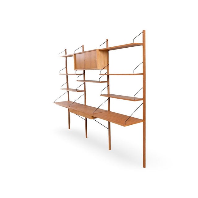 We are offering a beautiful, large wall shelf from the traditional Danish manufacturer Cado, dating from the 1960s, for...