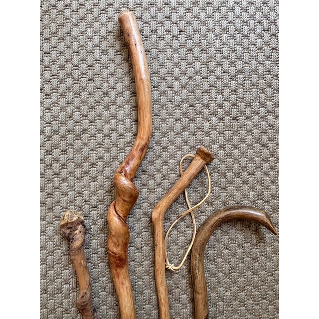 Hand-carved set of four twisted and knobby walking sticks. Each one is unique. Please see condition details noted....