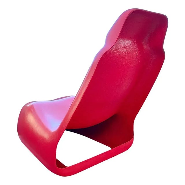 "Moby Dick" armchair, design Alberto Rosselli for Saporiti, 1969, here proposed in a rare Ferrari red version. Measuring...