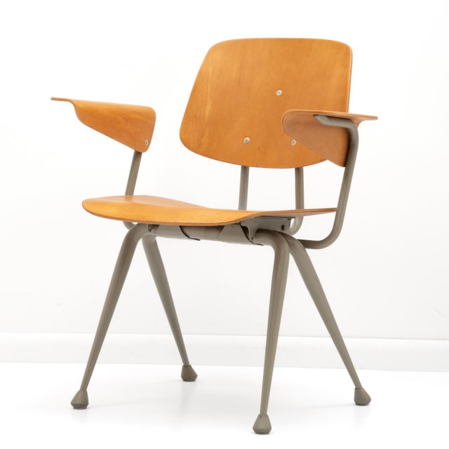 A gorgeous set of four Mid Century maple armchairs by Brunswick styled after the iconic designs of Charles and Ray Eames...