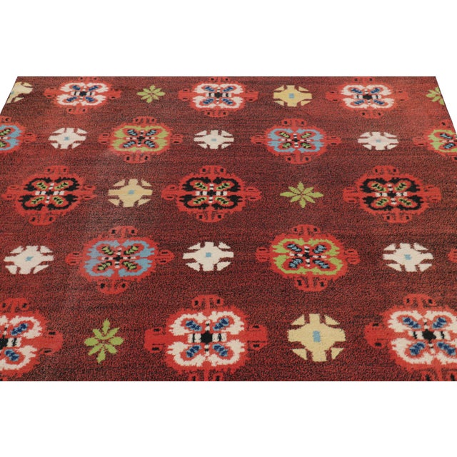 Hand-knotted in wool, this 6x9 vintage rug originating from Turkey, circa 1960-1970, is a very special piece, featuring a...