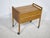 Mid-century sewing box on wheels from the 1960s. Compact, functional design with clean lines and a warm wood tone in the...