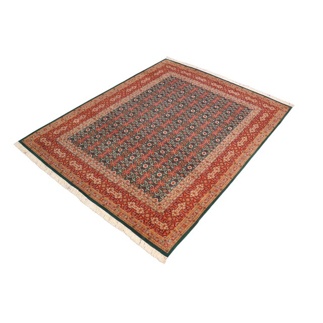 Designed with mesmerizing intricacy and gorgeous color palette, this hand-knotted masterpiece demonstrates the beauty and...