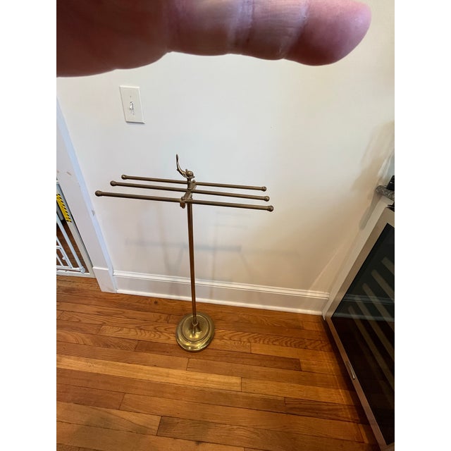 Hollywood Regency antique style brass valet towel stand. Stylish and elegant brass valet stand with fish motif. 6 bars for...