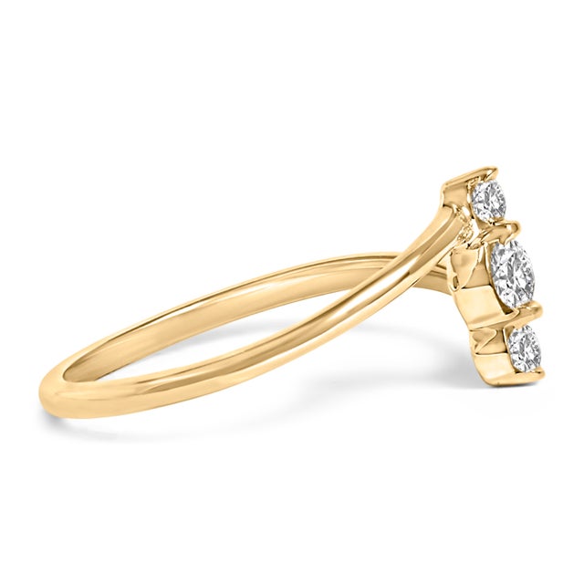 Discover elegance redefined with this exquisite ring, crafted in lustrous 10K yellow gold. Its smooth band graces the...