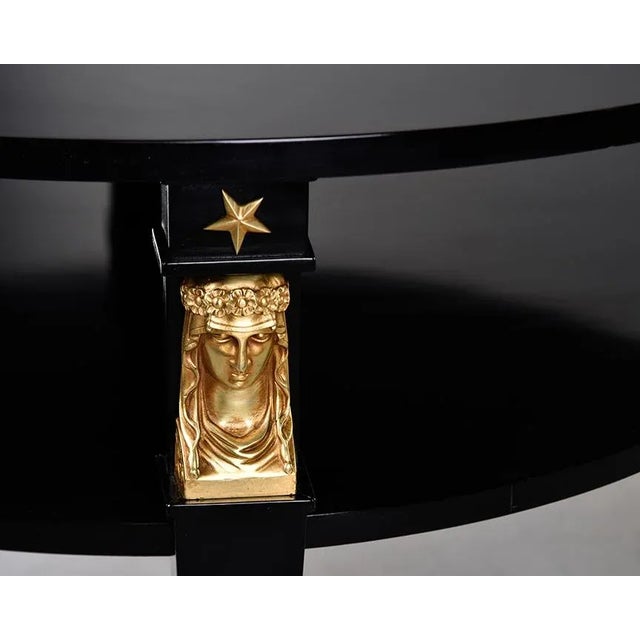 Found in France, this two tier round table has strong empire / neoclassic style elements. We had the table professionally...