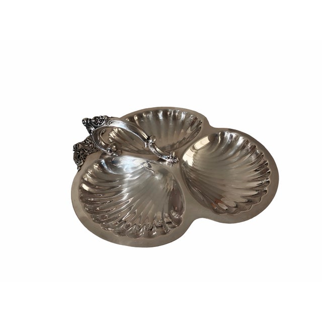 An iconic piece of mid-century American silverplate design, this Wallace Baroque three-part relish dish showcases the...