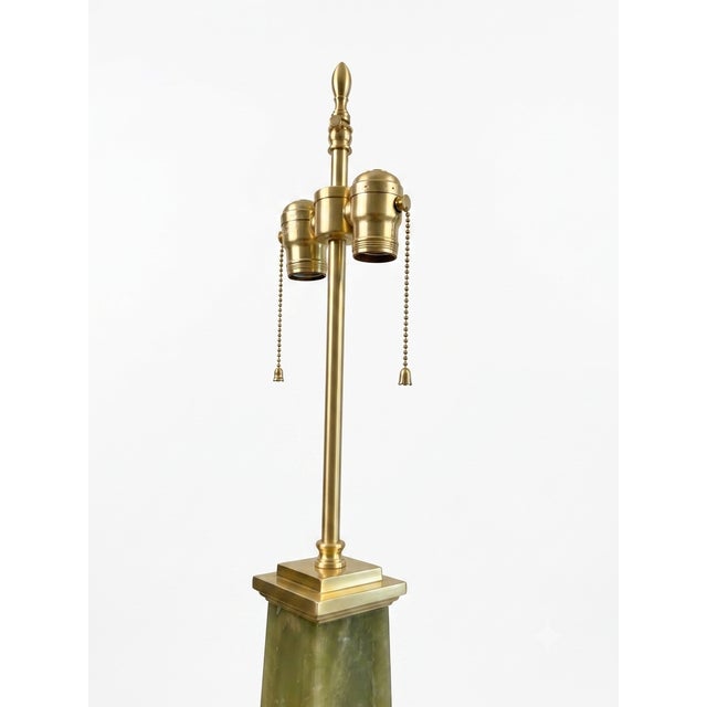 Original Warren Kessler 1960s obelisk table lamp made of solid brass. The exquisite lamp features a double light cluster...