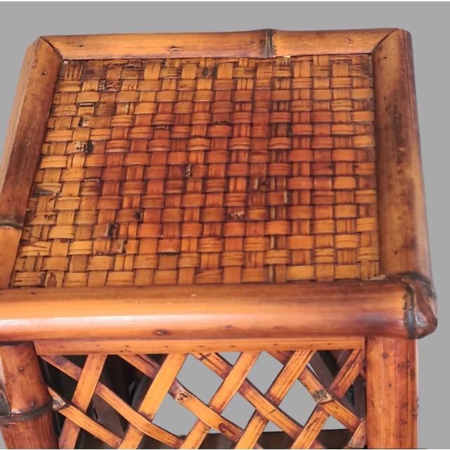 Enhance the charm of your indoor space with this beautifully crafted vintage bamboo pedestal plant stand. The 30-inch tall...